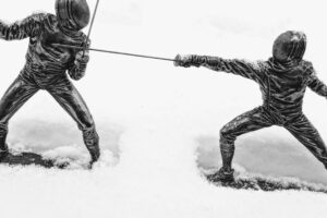metal fencer statue snow inclement weather